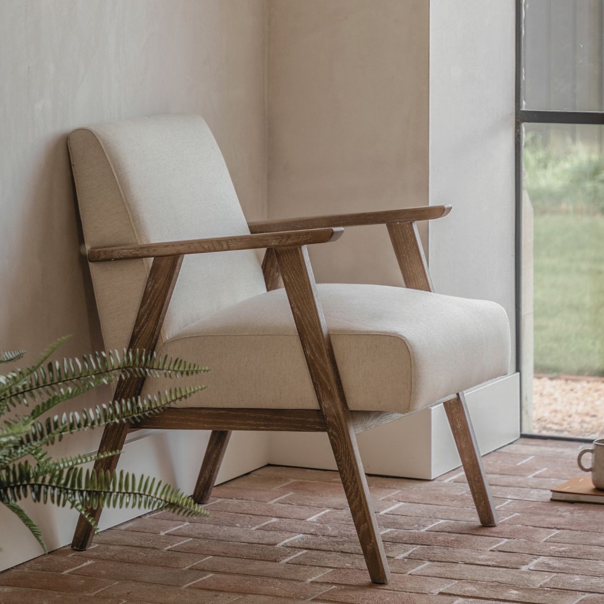 Barret mid century style armchair in natural linen upholstery and solid ash wood frame | malletandplane.com