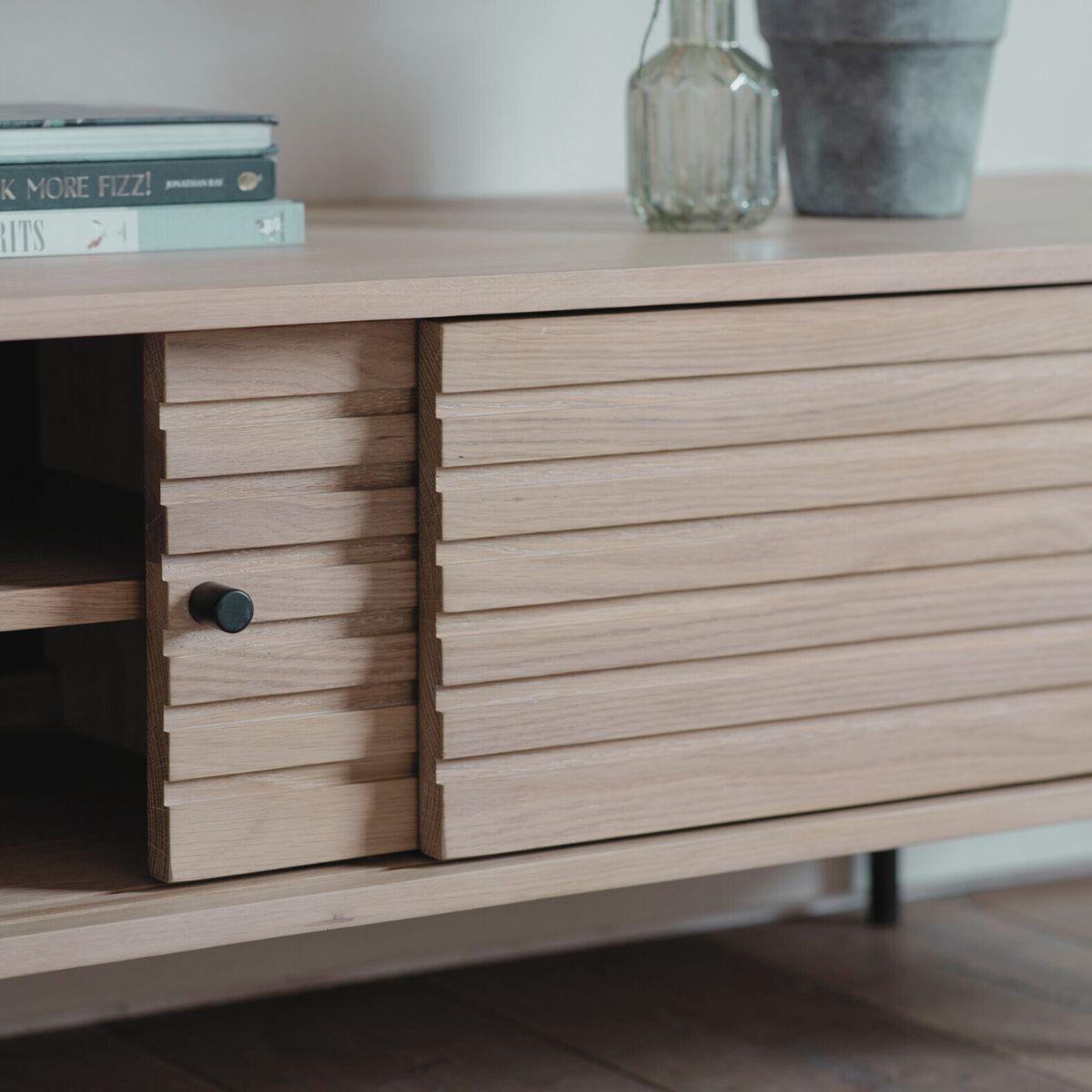 Kori oak and steel media unit with sliding doors and Japandi slatted detailing | malletandplane.com