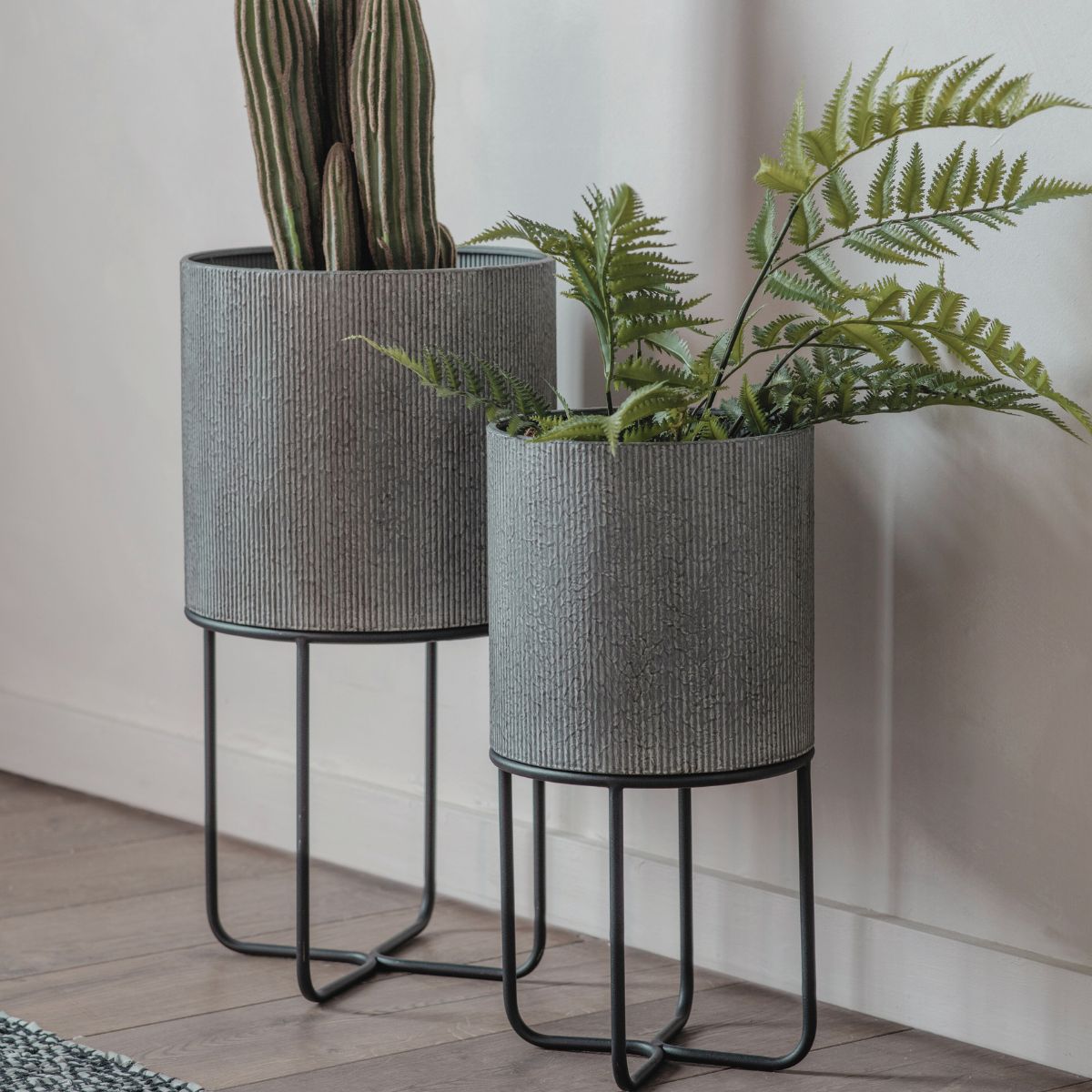 silver metal plant pots OLIVIA Metal Planter Set of 2 – Grey Ridged Finish with Black Stand