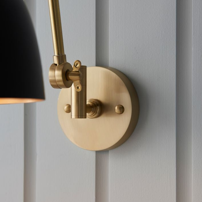Geiger adjustable wall light in antique brass and matt black | MalletandPlane.com