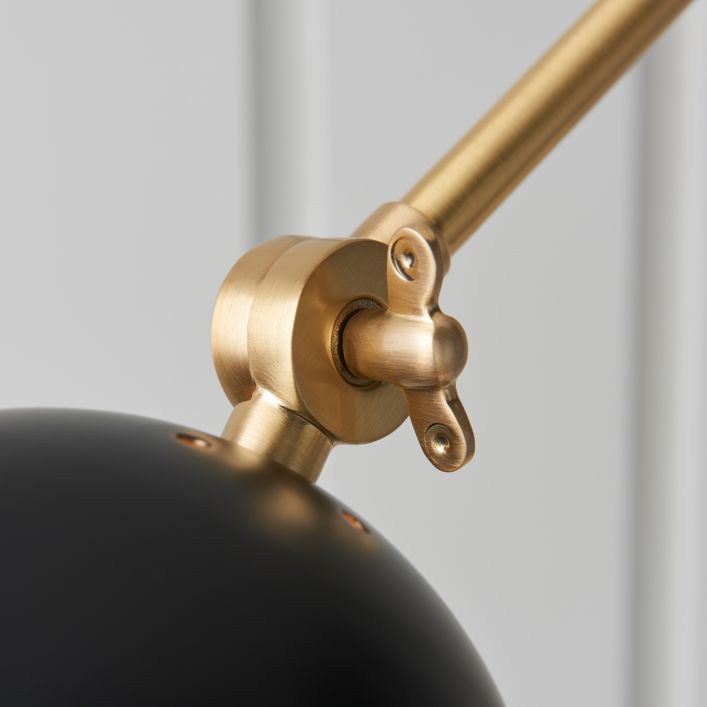 Geiger adjustable wall light in antique brass and matt black | MalletandPlane.com