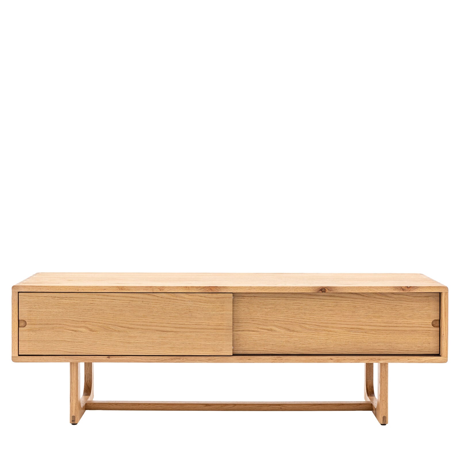 Artisan oak media unit with sliding doors and shaped underframe in natural finish | malletandplane.com