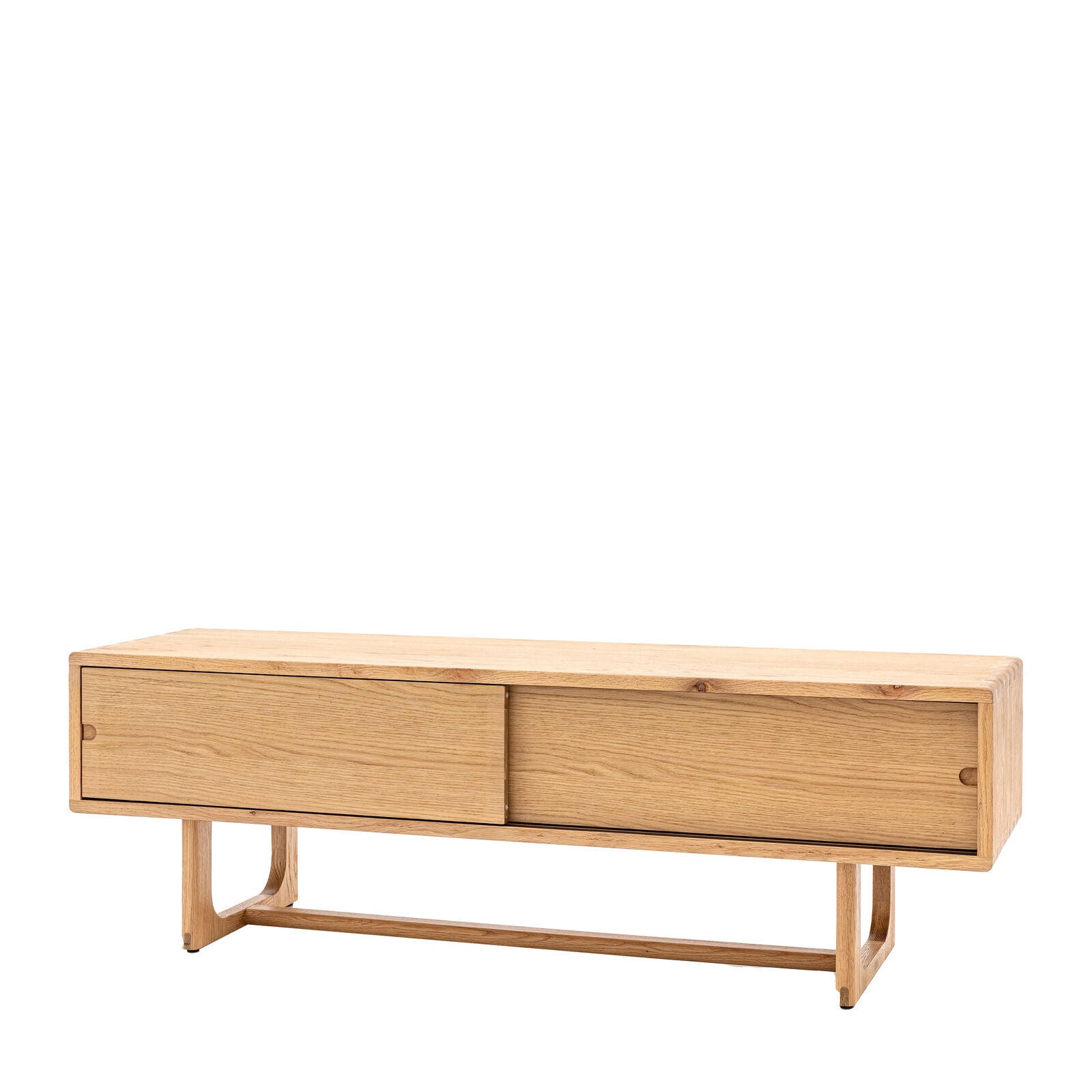 Artisan oak media unit with sliding doors and shaped underframe in natural finish | malletandplane.com