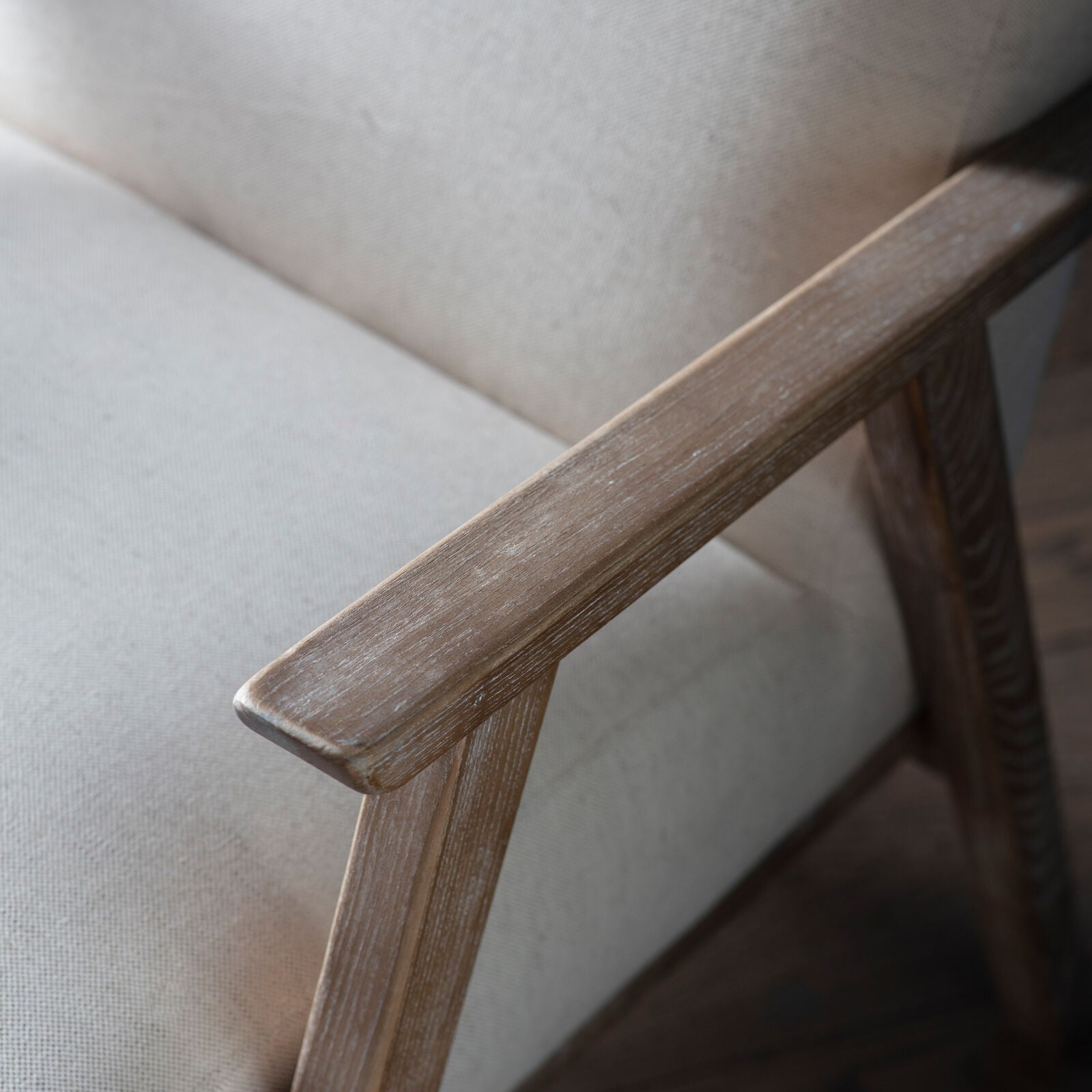 Barret mid century style armchair in natural linen upholstery and solid ash wood frame | malletandplane.com