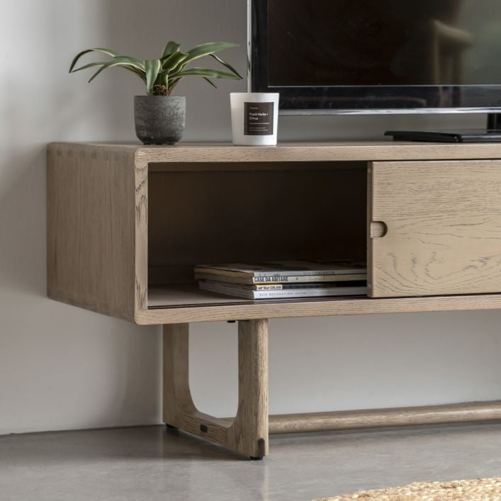 Artisan smoked oak TV stand with 2 sliding doors and featuring cut out handles | malletandplane.com