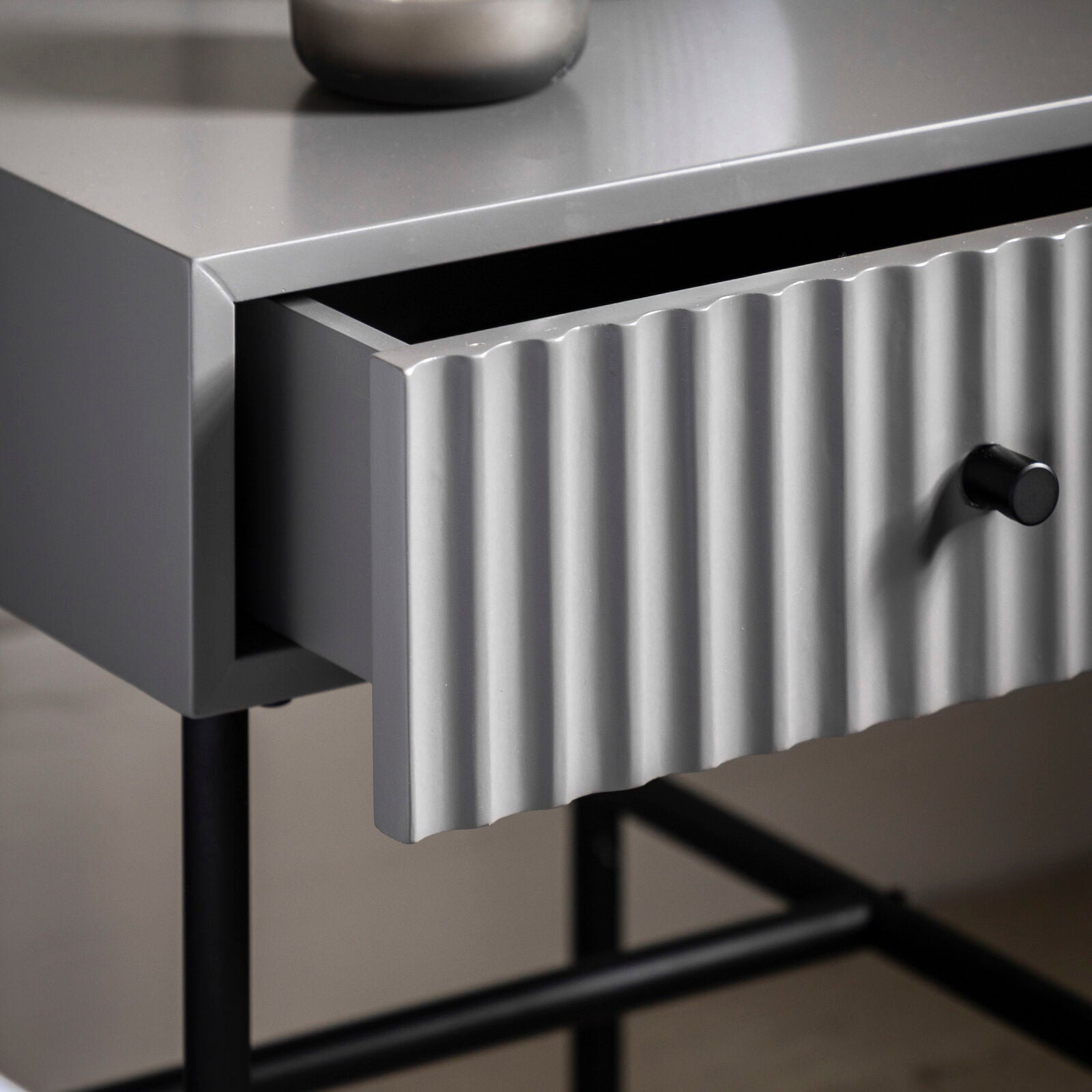 Flute bedside table with drawer in grey finish with scalloped fascia and black metal underframe | malletandplane.com