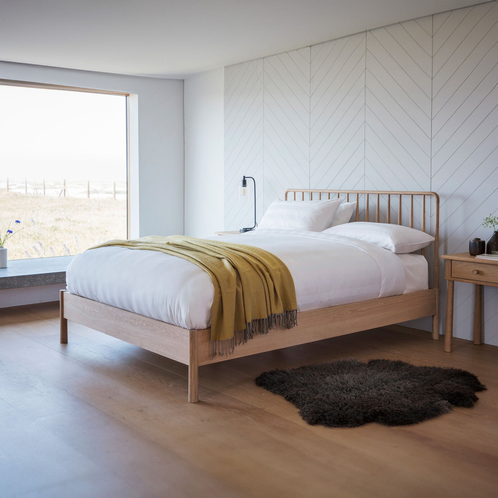 Axel natural oak king size bed with spindle details in vernacular style | malletandplane.com