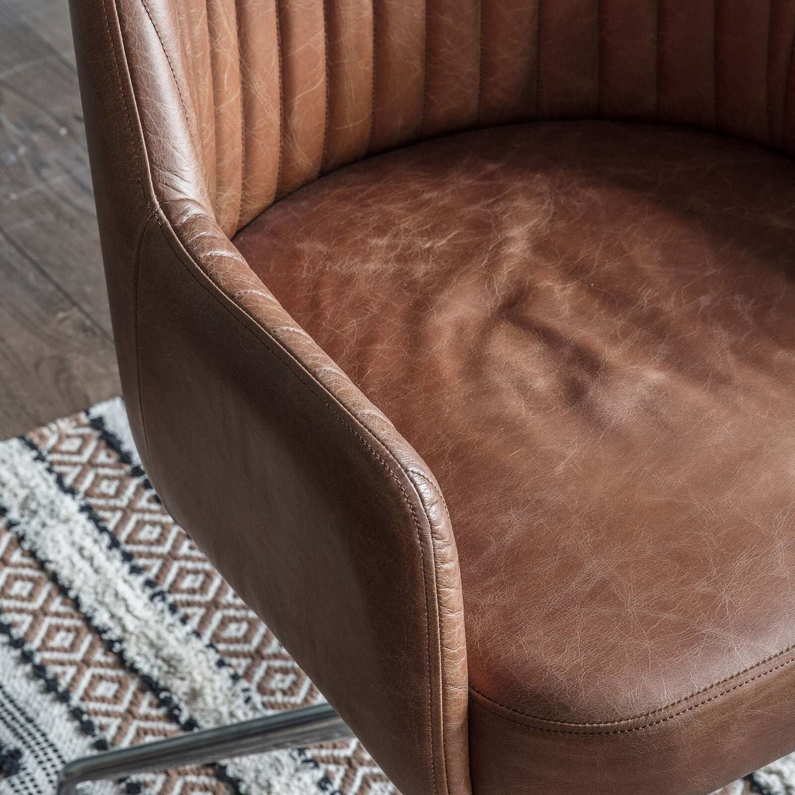 Ray leather upholstered padded swivel chair in antique brown leather hide | malletandplane.com