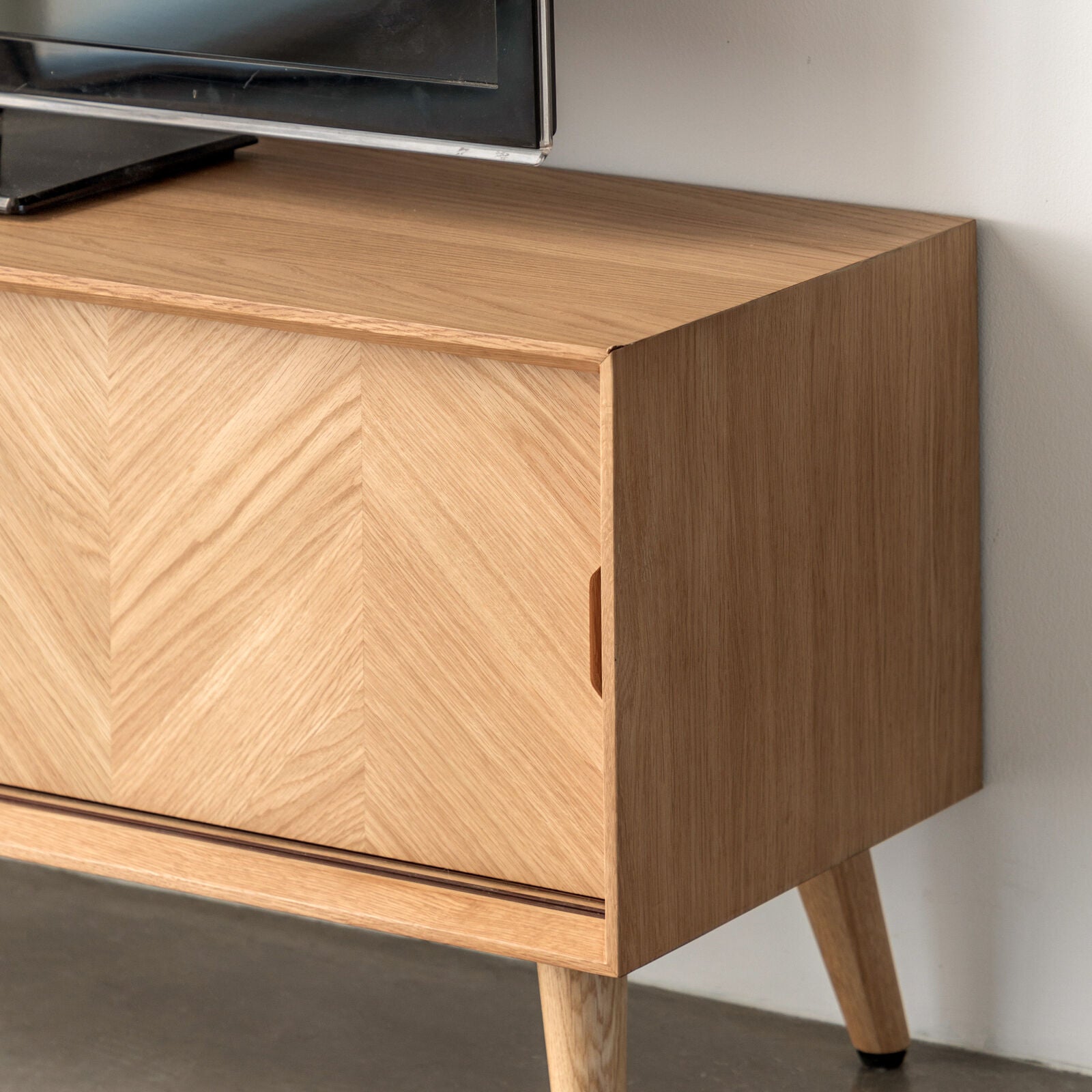 Jakob Oak TV Stand with Inlaid Chevron Design, 2 sliding doors, interior shelves and cable management access | MalletandPlane.com