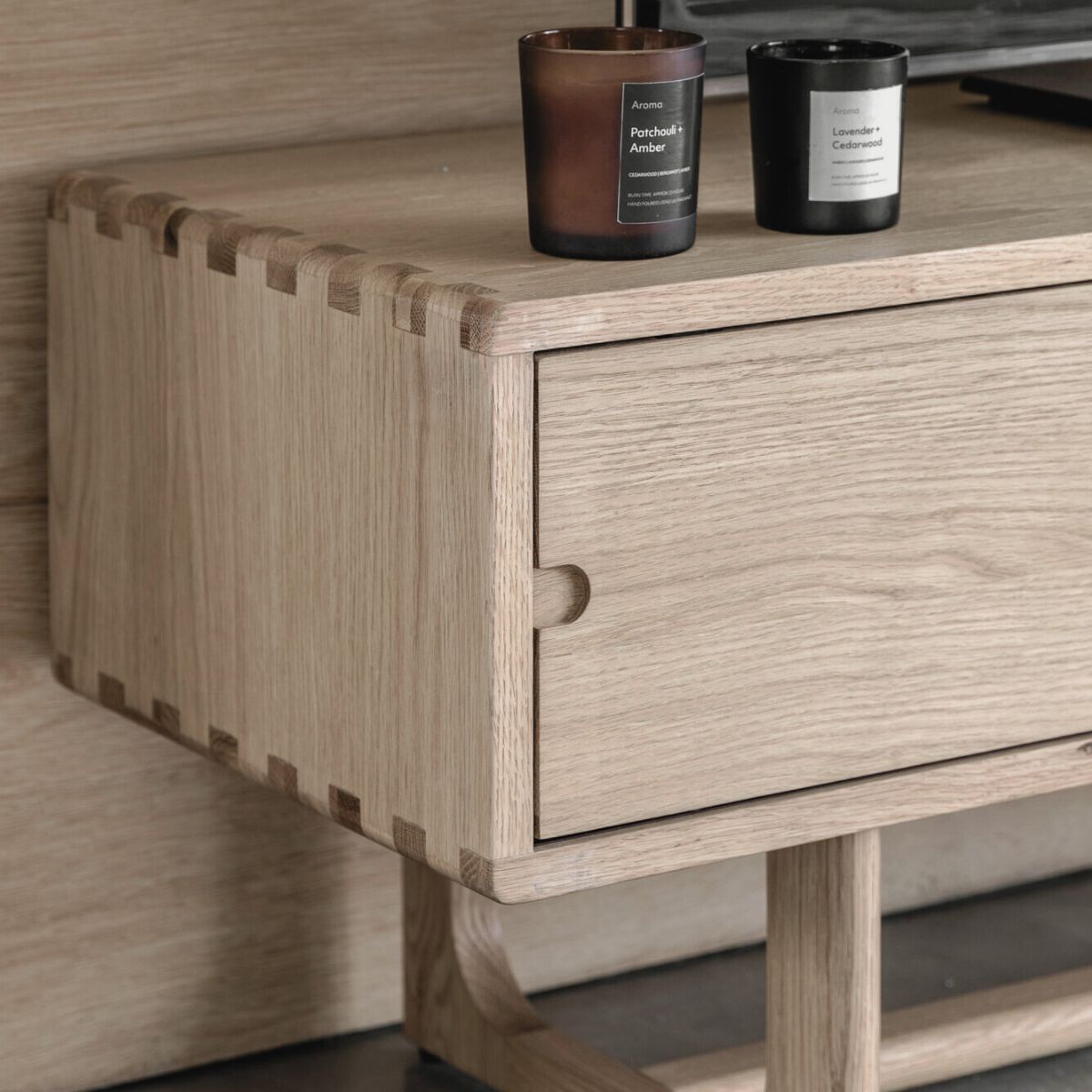 Kantu oak media unit with sliding doors and shaped underframe in natural finish | malletandplane.com