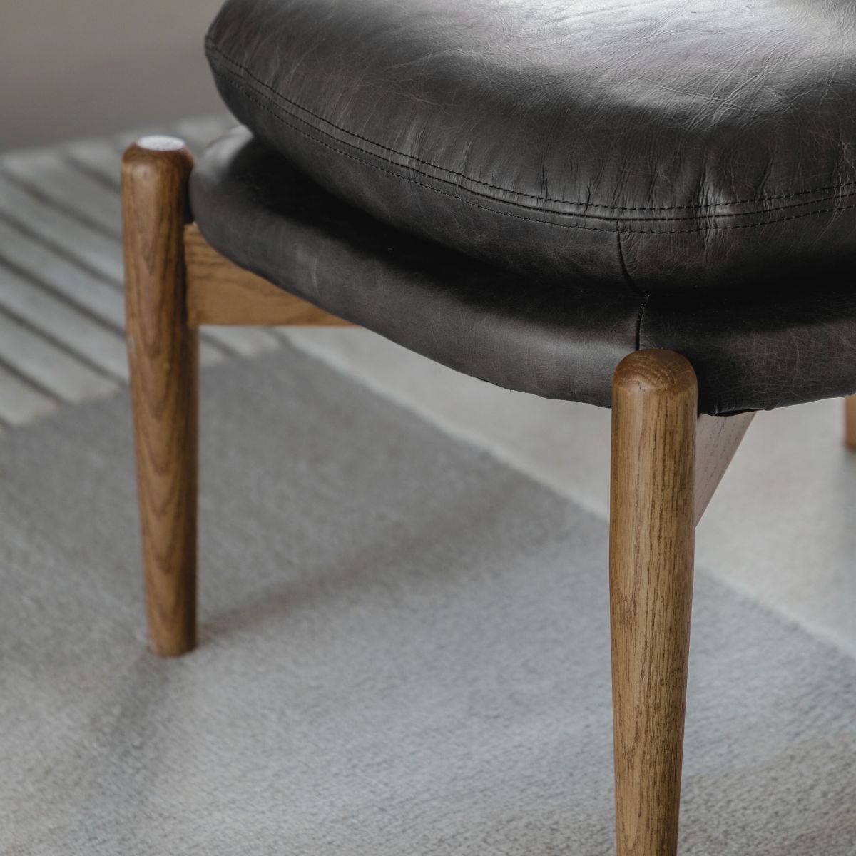 MARCUS Antique Ebony Leather Footstool | malletandplane.com