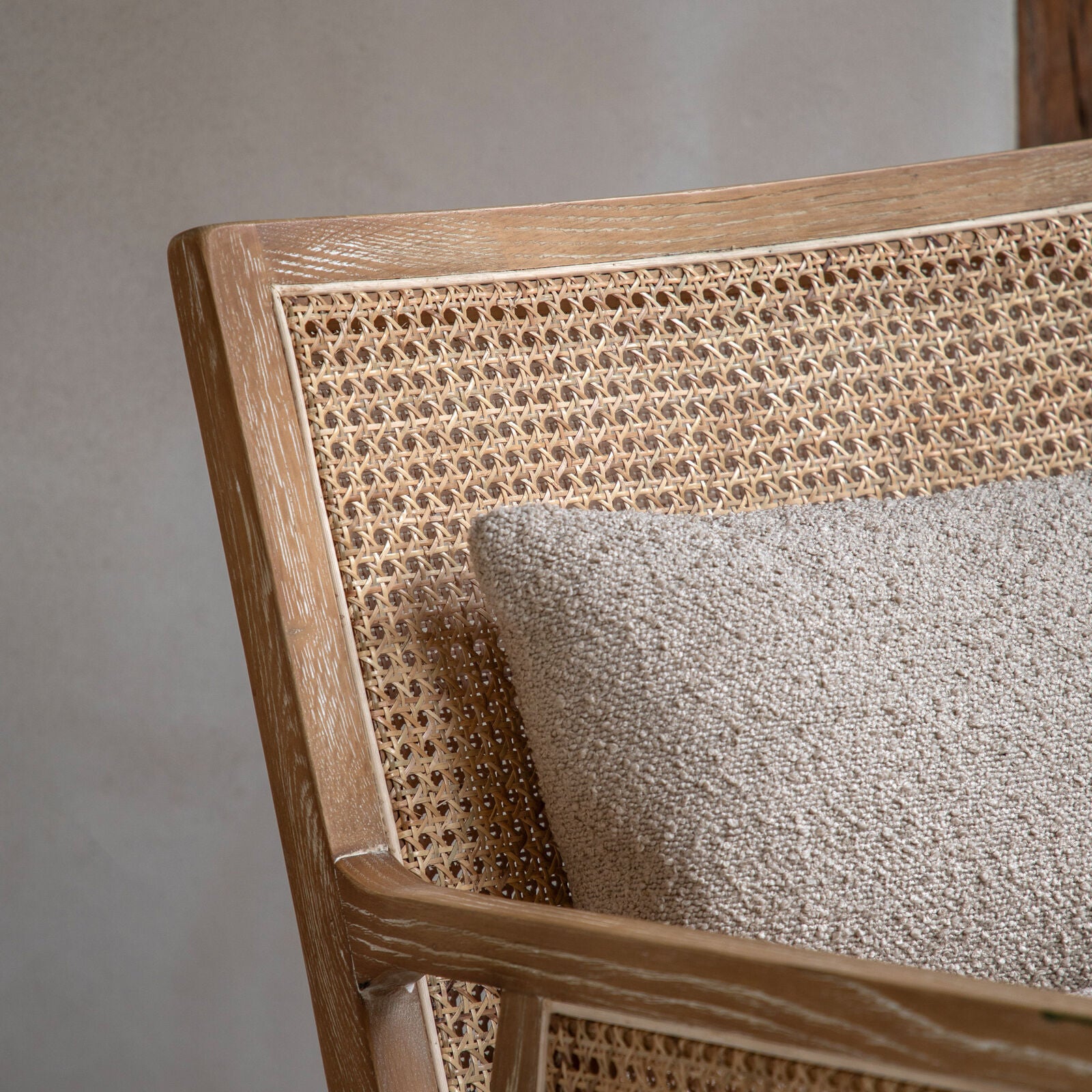 Osaka Natural Rattan Armchair with solid wood frame, woven rattan backrest and cream upholstered seat — stylish Scandinavian accent chair for living rooms and bedrooms. | malletandplane.com